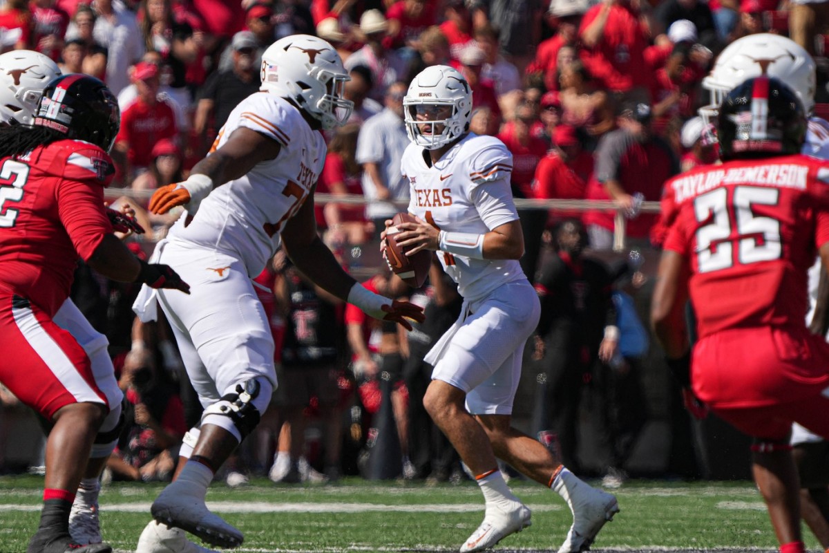 Sep 24, 2022; Lubbock, Texas, USA; Texas Longhorns quarterback Hudson Card (1) looks for an open receiver against the Texas Tech Red Raiders during a game at Jones AT&T Stadium.